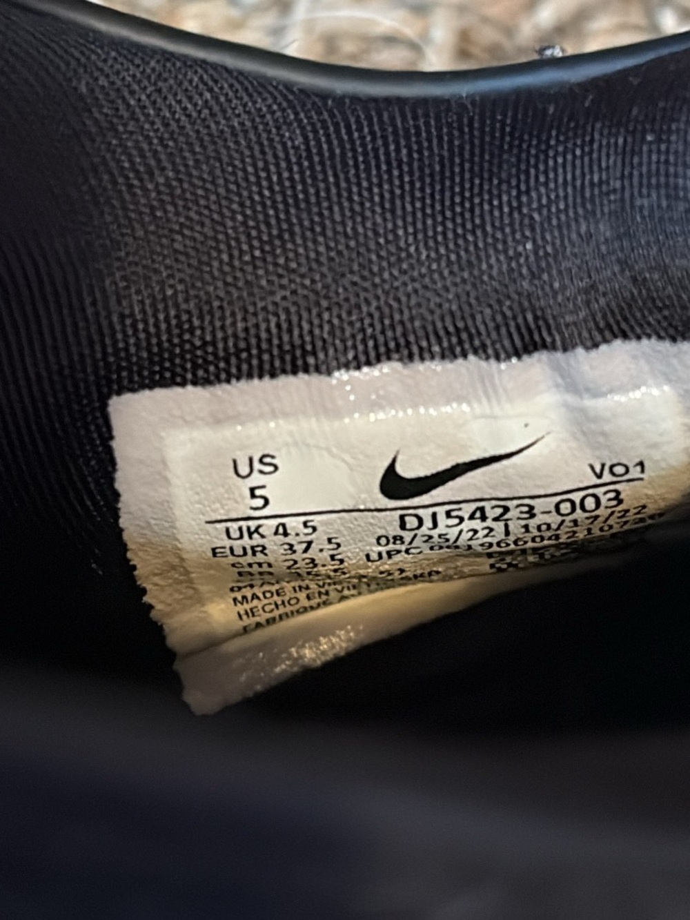 Nike Black Sneaker with Pink Label Accent